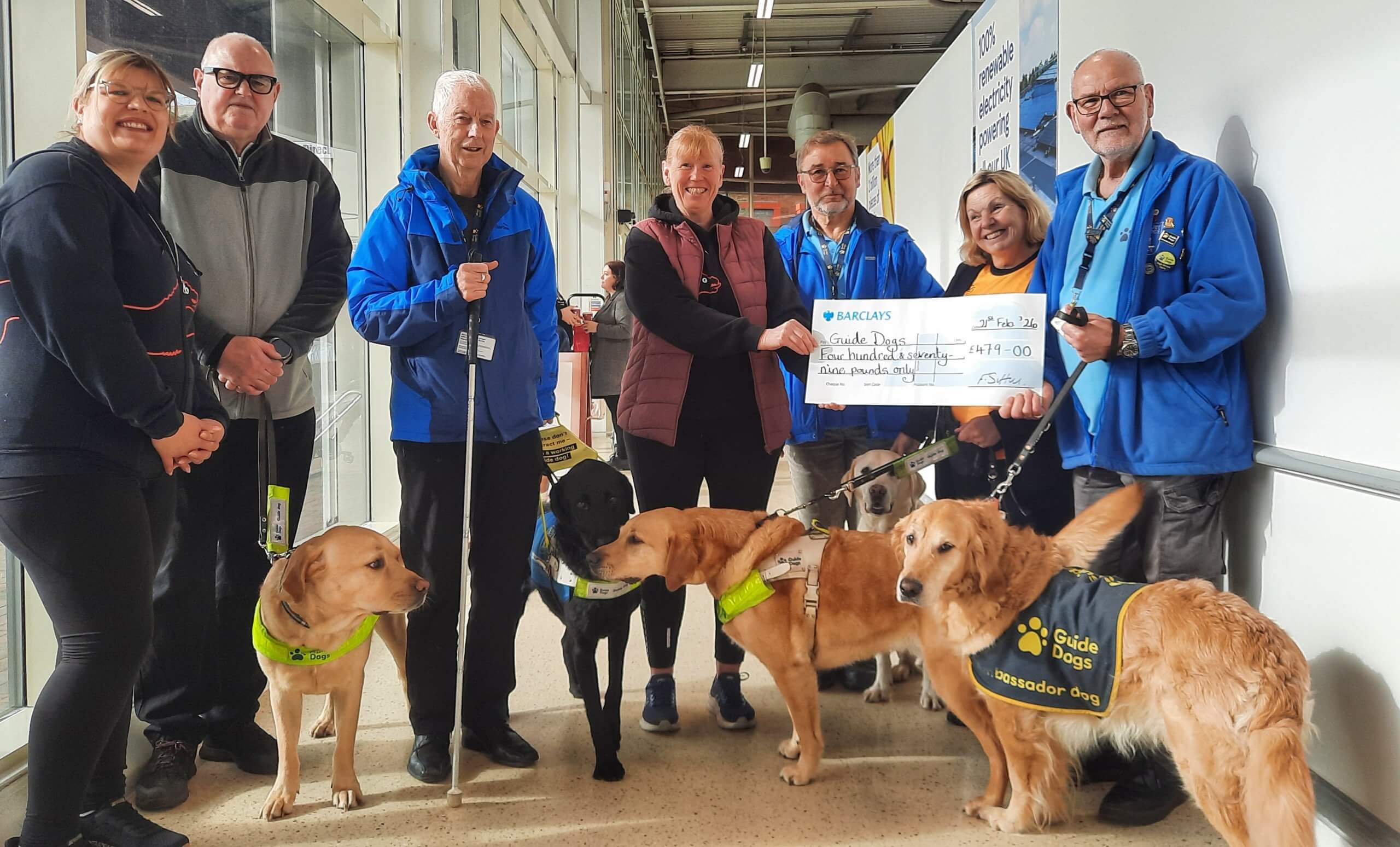 Cheque presentation buy Black Dog Runners to Guide Dog charity featuring guide dogs